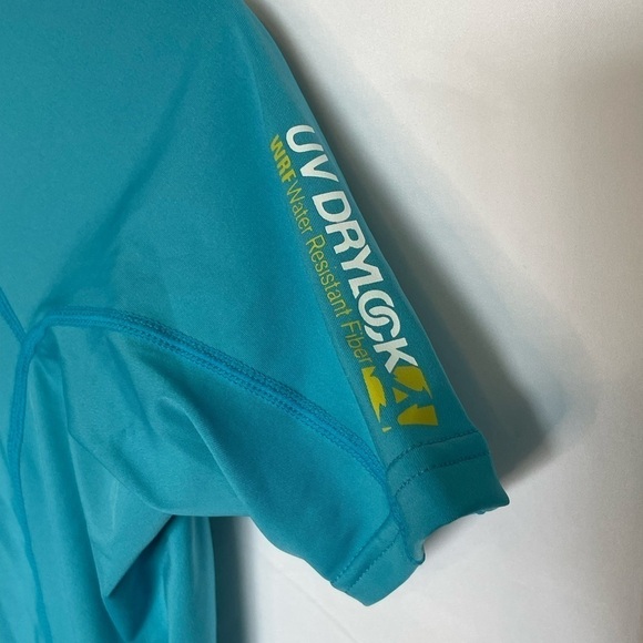 Xcel/ UV protection teal short sleeved swim shirt with one small pocket‌ - Picture 4 of 6